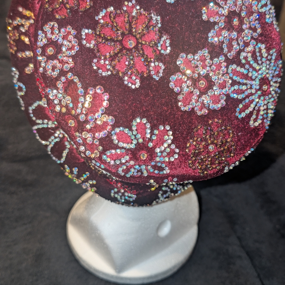 A burgundy velvet hat embellished with glass and Swavorsky crystal gems. - Picture 6 of 11